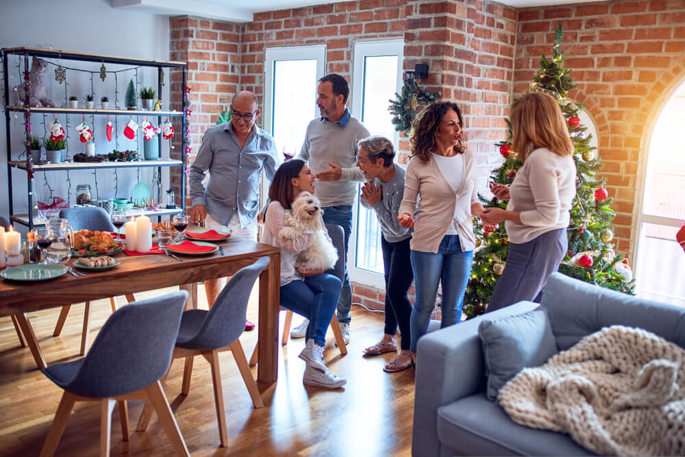 House guests standing with dog